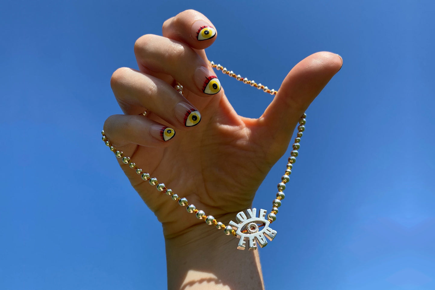 Spinning Eye Pendant with silver beads